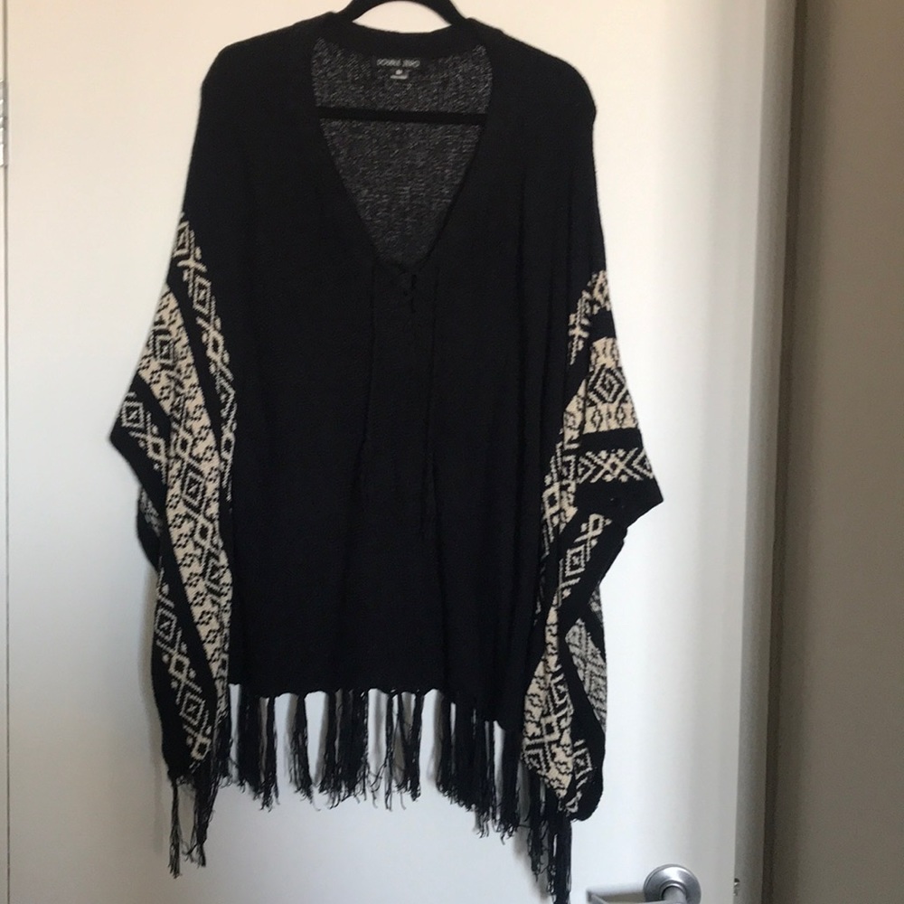 Black sweater poncho with fringe